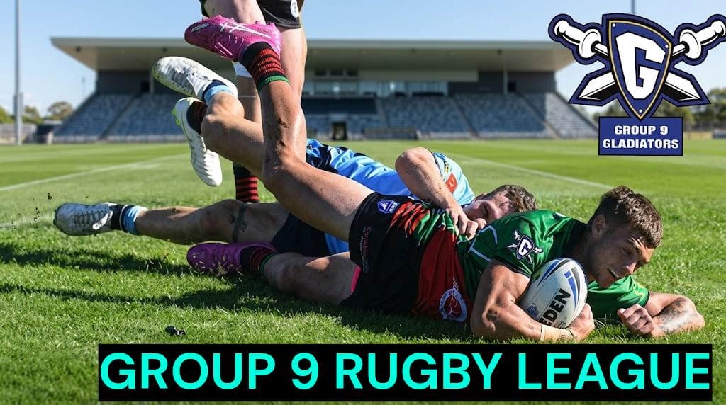 Professional photograph of six Group 9 Rugby League players on a stadium pitch, looking towards a massive digital scoreboard displaying the Group 9 RL 2026 Premiership Ladder. The scoreboard provides detailed Round 1 Results, including Kangaroos 24-22, Young Cherrypickers 34-28, Junee Diesels 18-14, and Cootamundra Bulldogs 32-24. The official league 'G' Gladiators logo is prominent, and the Ladder shows teams with 2 points, 1 point (Tumut Blues, Wagga Brothers), and 0 points. The image has a crisp, authoritative, game-day feel. tttt