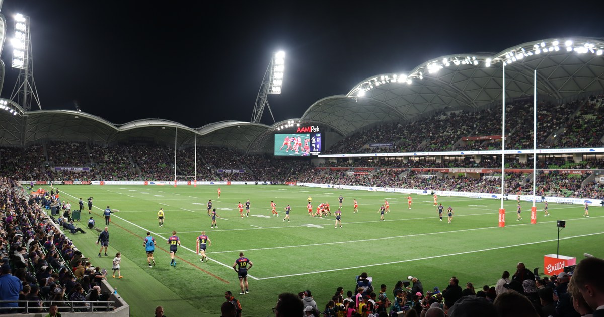 The Dolphins in action under lights in an NRL match against the Melbourne Storm
