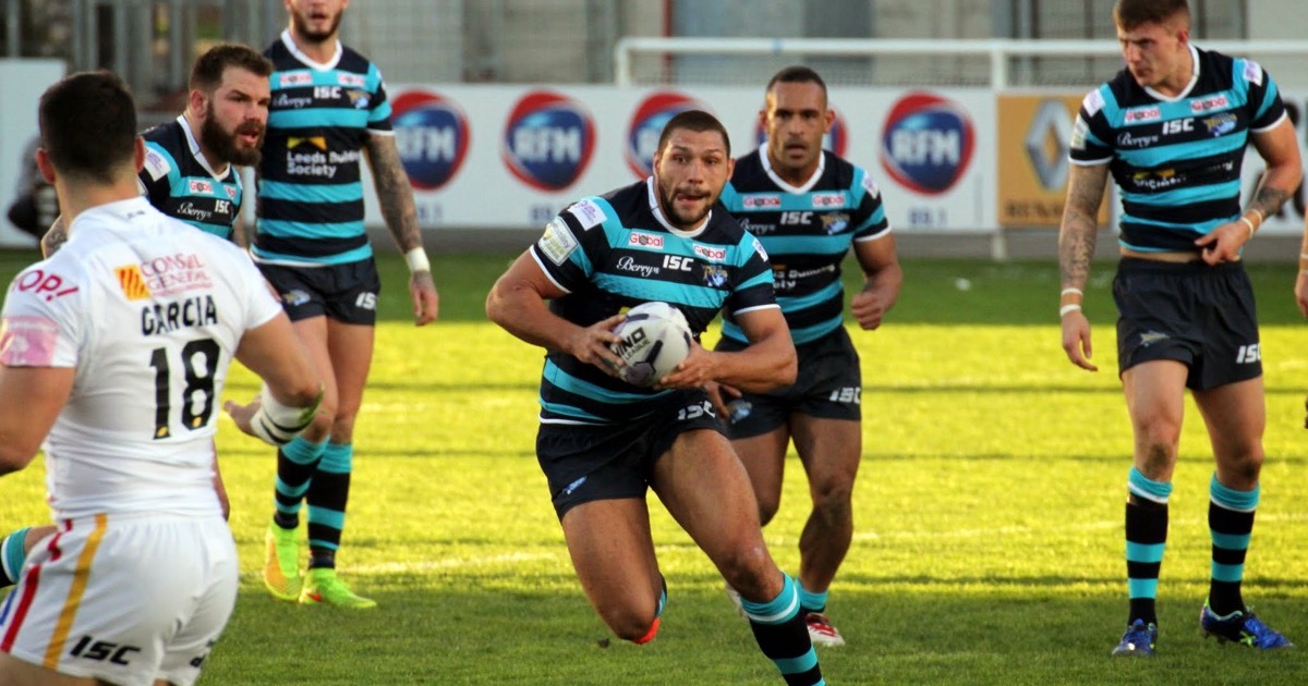 Ryan Hall carrying the ball in a rugby league match