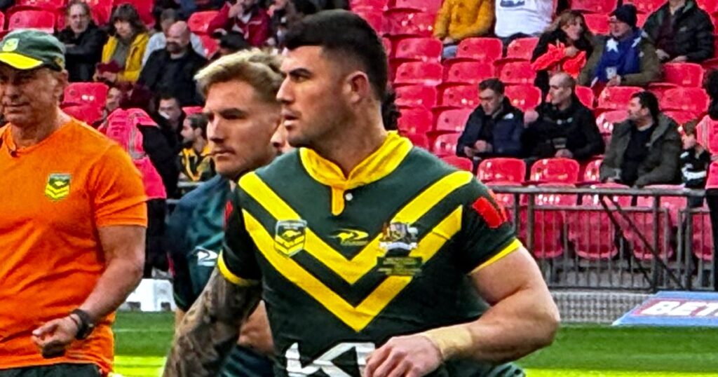 Bradman Best in a green and gold Kangaroos jersey on the field