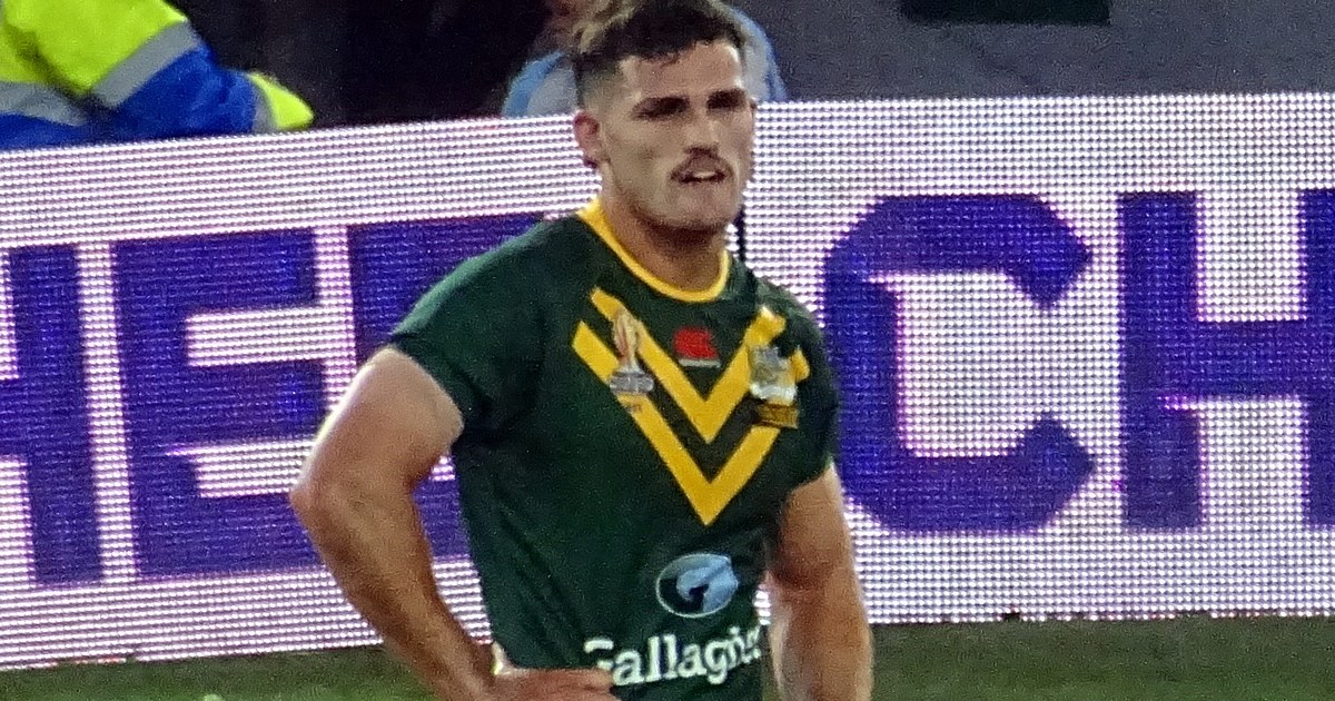 Nathan Cleary standing with hands on hips in the Australian Kangaroos jersey