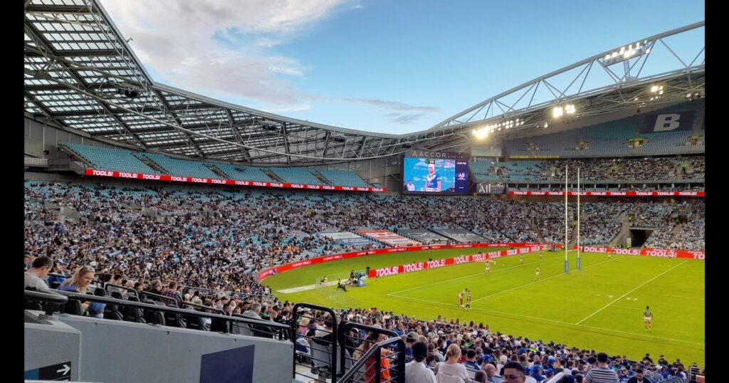 A rugby league match at Accor Stadium in Sydney seen from the stands