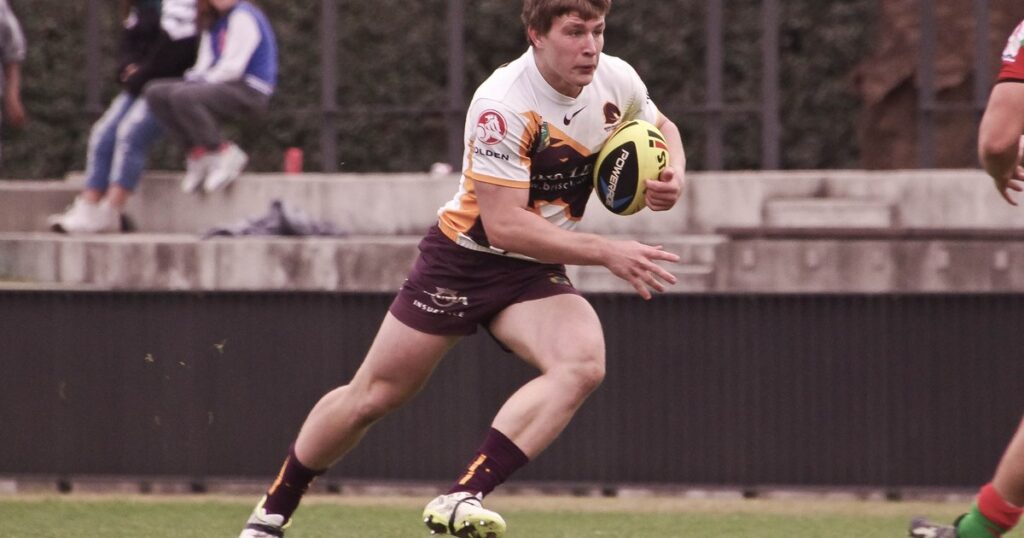 Jai Arrow running with the ball in Brisbane Broncos colours in 2014