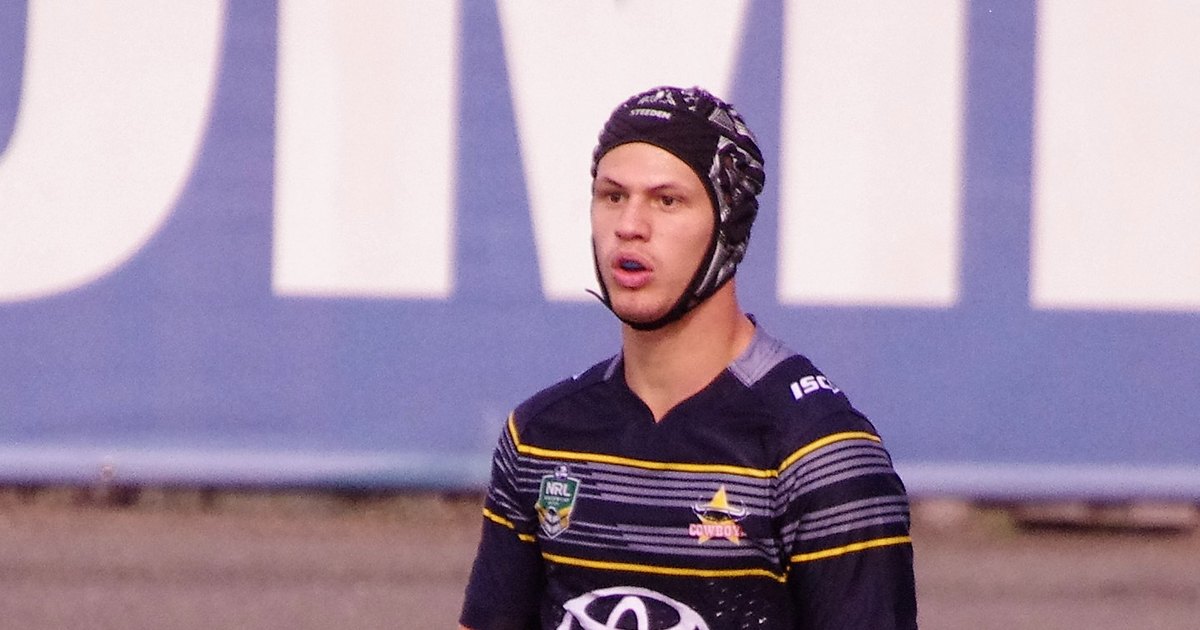 Kalyn Ponga in headgear and a North Queensland Cowboys jersey holding a ball