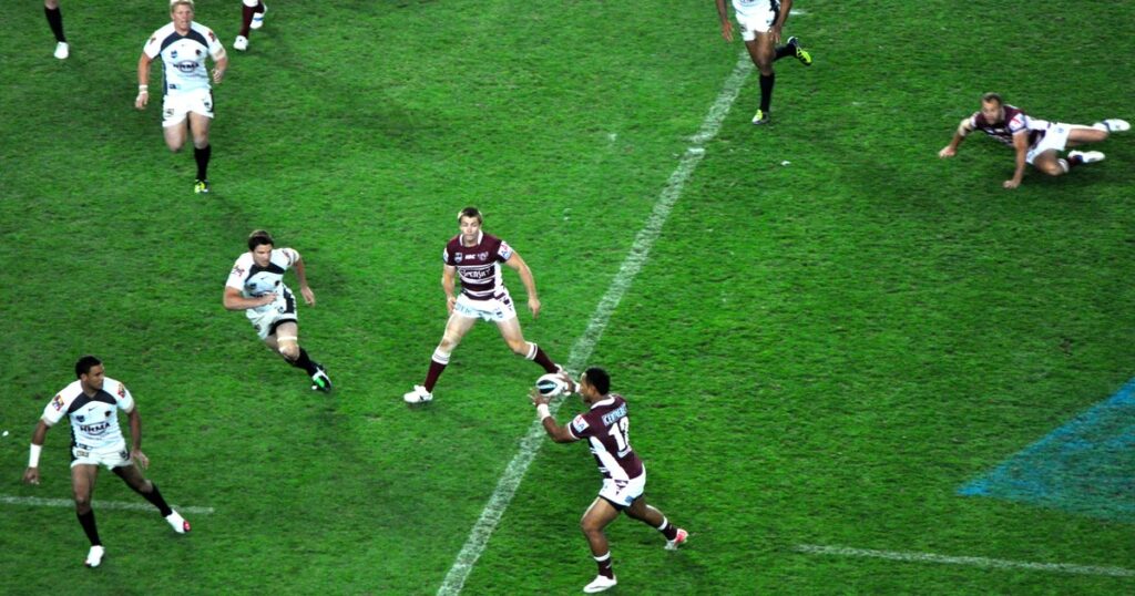 Manly Sea Eagles players in attack during a 2011 NRL finals match