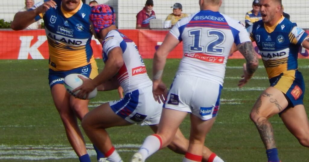 Kalyn Ponga in a Newcastle Knights jersey and headgear during a match against Parramatta