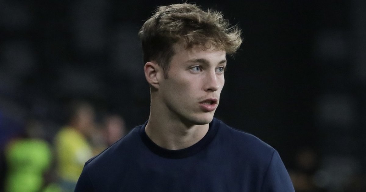 Sam Walker in a navy Easts jumper looking to his left