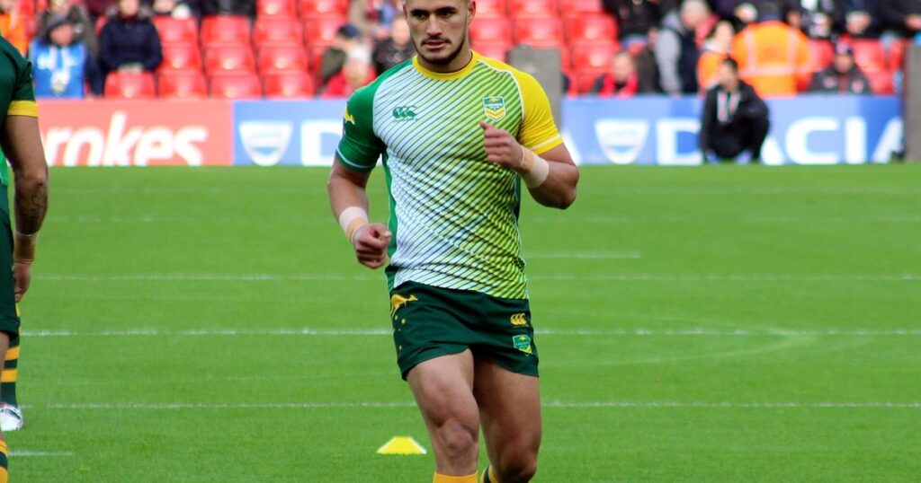 Valentine Holmes in a green and gold Australia training top on the field before a Test